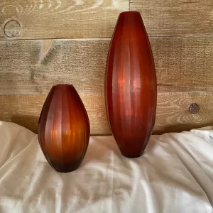 red cut glass vase side by side