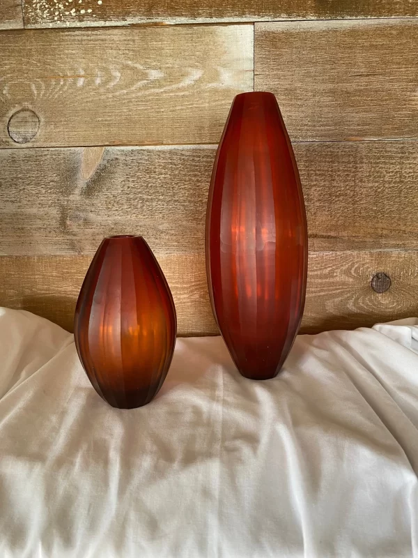 red cut glass vase side by side