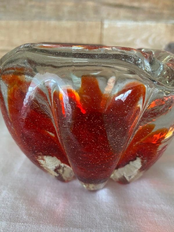 Red glass ashtray vintage art glass closeup side view