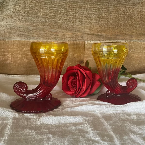 red and yellow glass vase fronts with rose