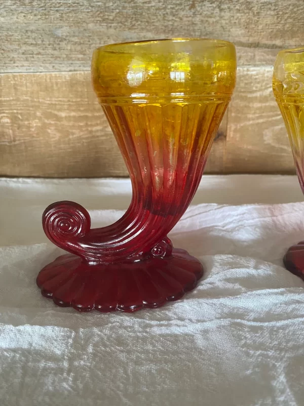 red and yellow glass vase left front close