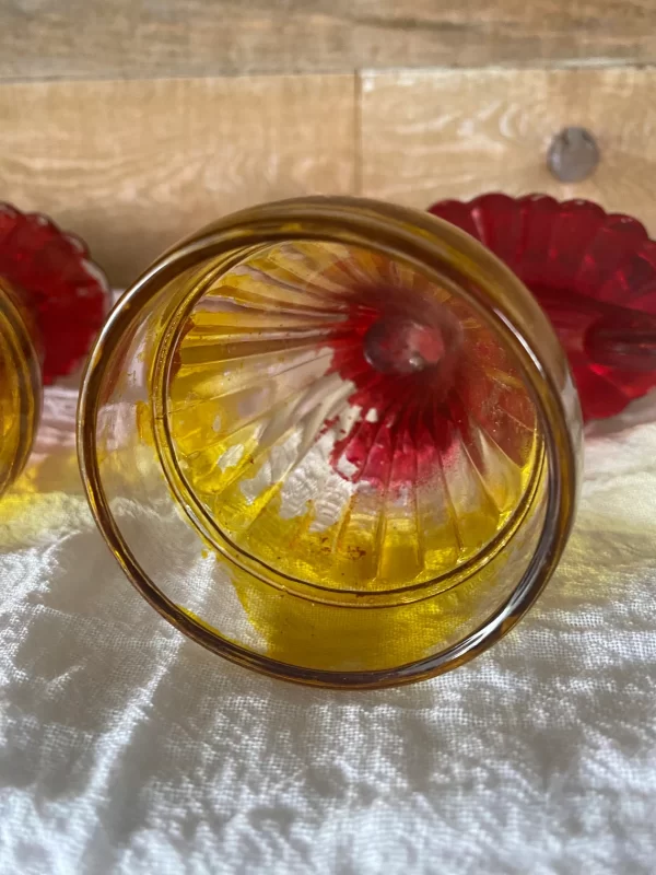 red and yellow glass vase missing paint