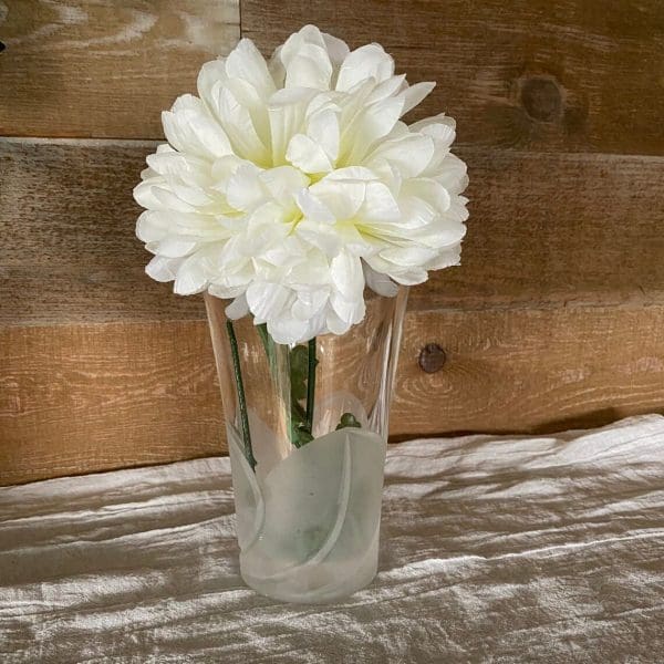 frosted glass vase with flower