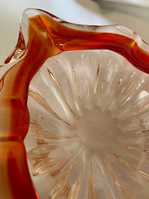 Red glass cigar ashtray close up of other side