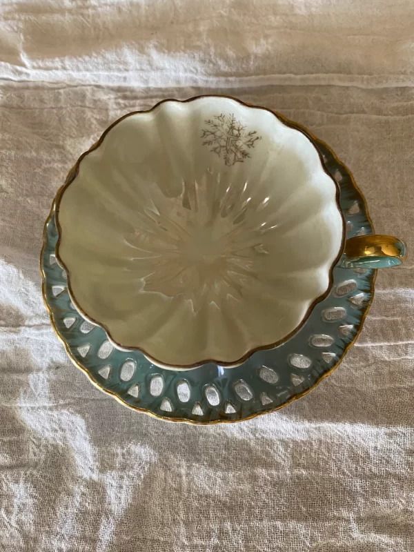 Lefton china hand painted tea cup and saucer blue with gold snowflakes tea cup top view