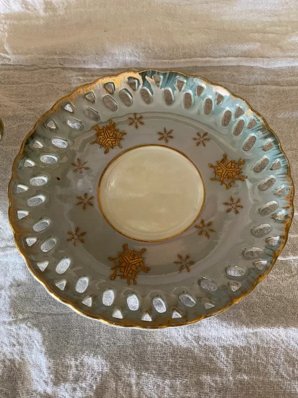 Lefton china hand painted tea cup and saucer blue with gold snowflakes saucer top view