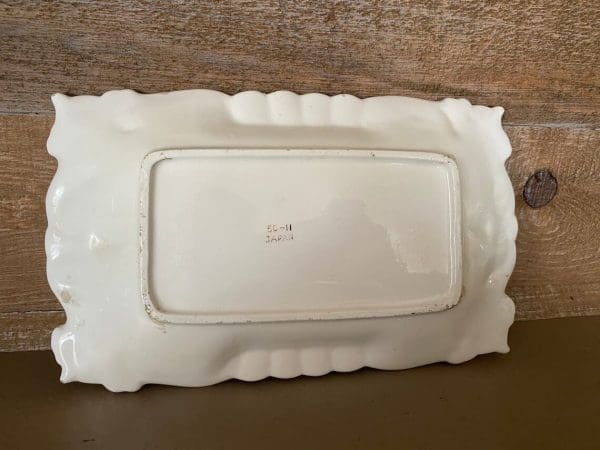 Japan ashtray olive green with white scrolling trim, rectangle 1950s bottom showing "Japan" 50-11 markings