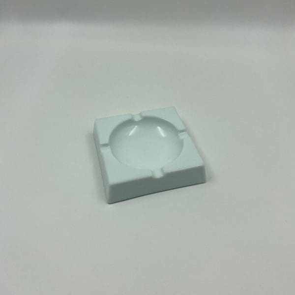 milk glass ashtray sitting showing unique modern design