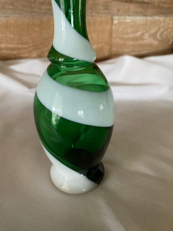 vintage small green glass vase close of base