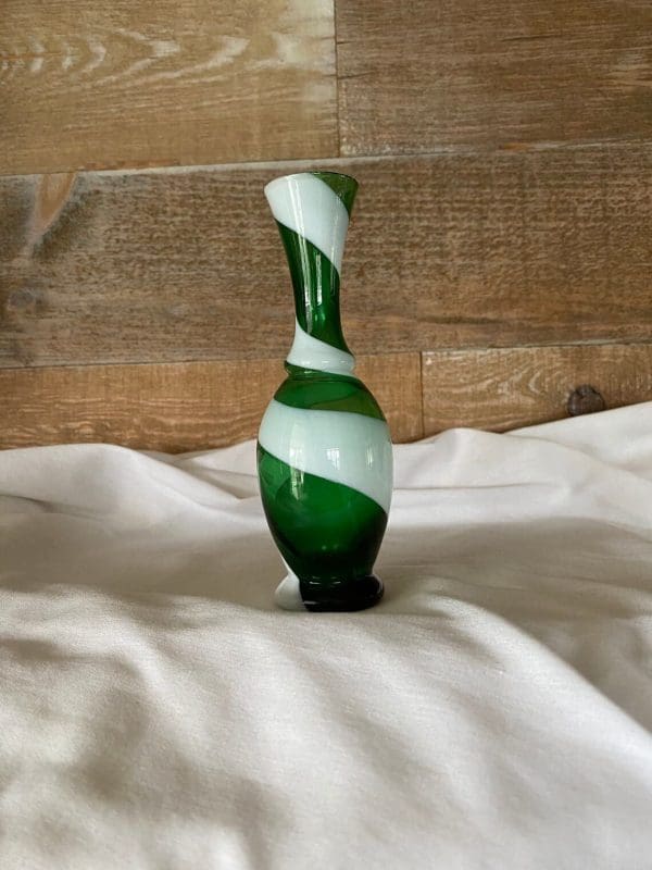 vintage small green glass vase looking up