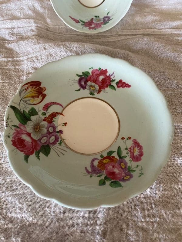 Paragon fine bone china tea cup and saucer with colorful flowers on blue backdrop saucer