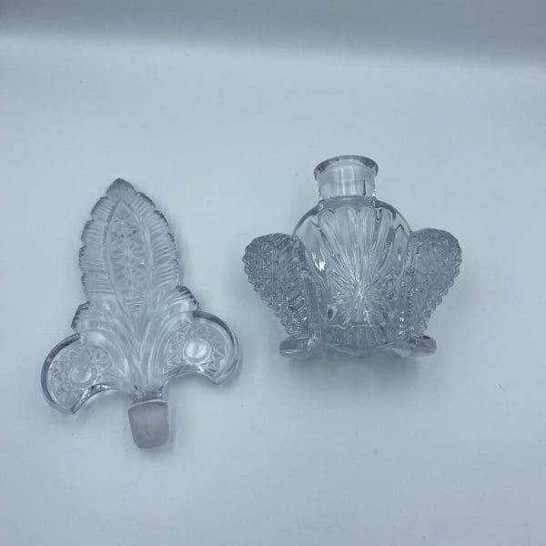 vintage crystal perfume bottles with stoppers, Fleur de Lis design stopper separated on side