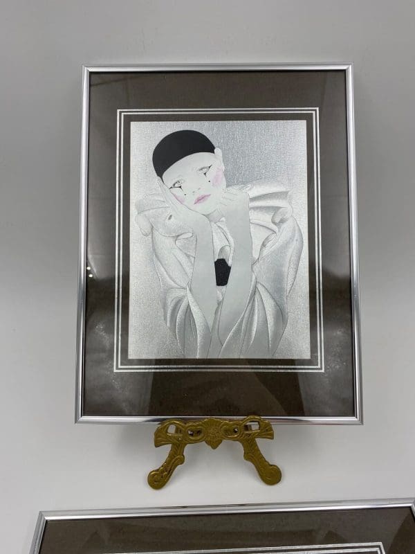 vintage foil art close of one of the set a mime with black hat