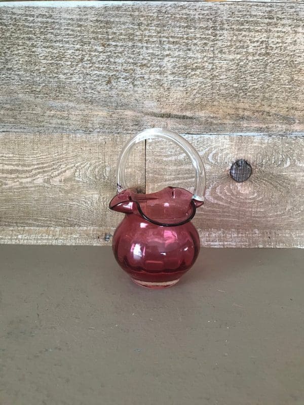 pink glass basket with smooth clear glass handle