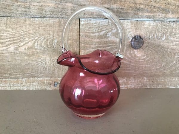 pink glass basket clear glass handle close front