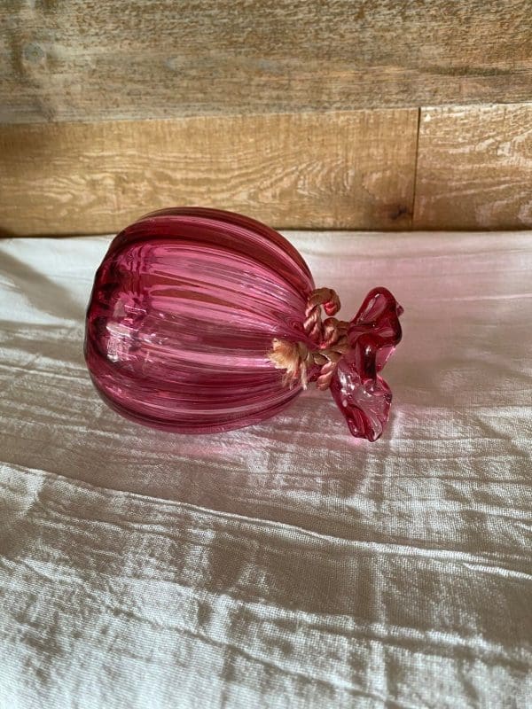 pink glass vase vintage laying on side