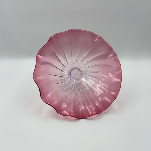 glass pedestal bowl on side pink glass