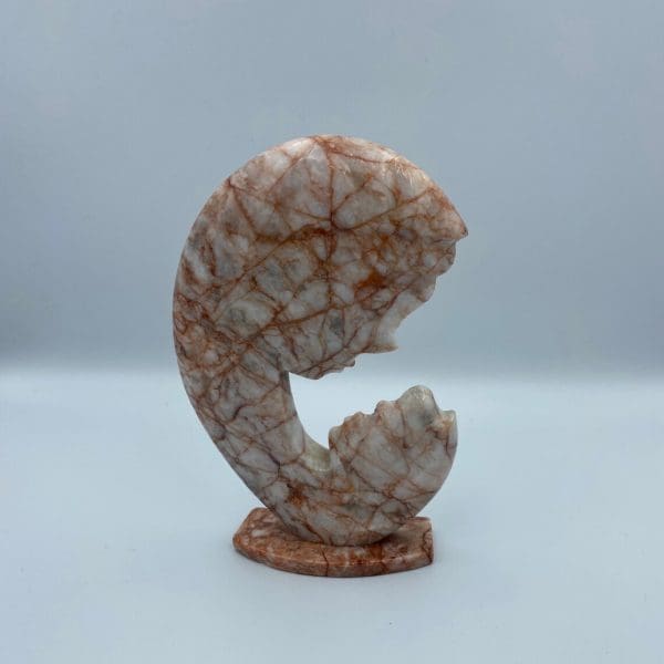 pink marble statue mother and child