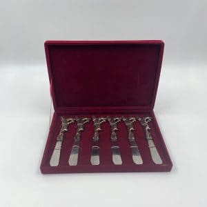 Christmas butter knives set of six in red velvet case handles all have different reindeer name embossed into them and each handle is shaped like a reindeer