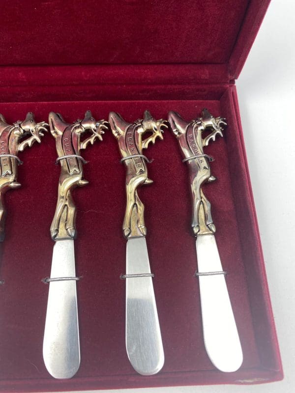 Christmas butter knives close of Cupid, Prancer, Dasher