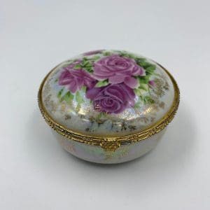 vintage trinket dish with pink rose design and metal rim