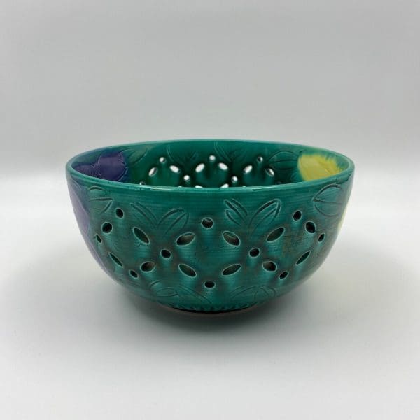 vintage green pottery bowl close of pieced design