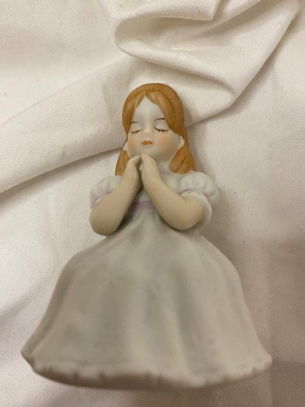 first communion figurines laying