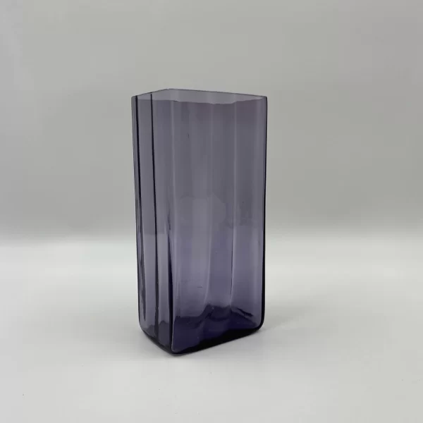 large purple glass vase at an angle