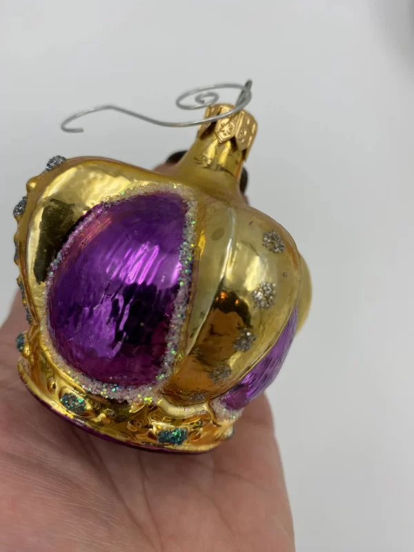 vintage Radko ornaments in hand purple gold crown