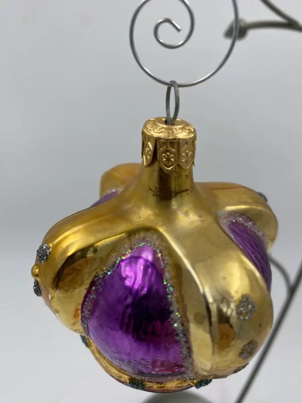 vintage Radko ornaments close of top on purple gold crown