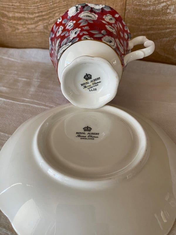 Royal Albert tea cup and saucer fuchsia and grey silver chintz pattern. Showing bottoms of Paragon stamp on tea cup and saucer