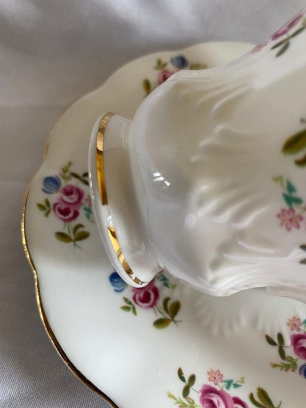 Royal Albert bone china tea cup floral pattern showing slight wear to gold trim on tea cup