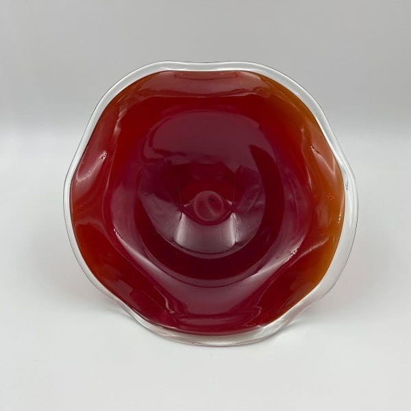 vintage glass compote inside of red glass bowl