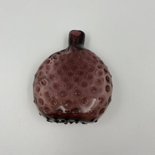 amethyst glass bottle pocket flask saddle flask on side