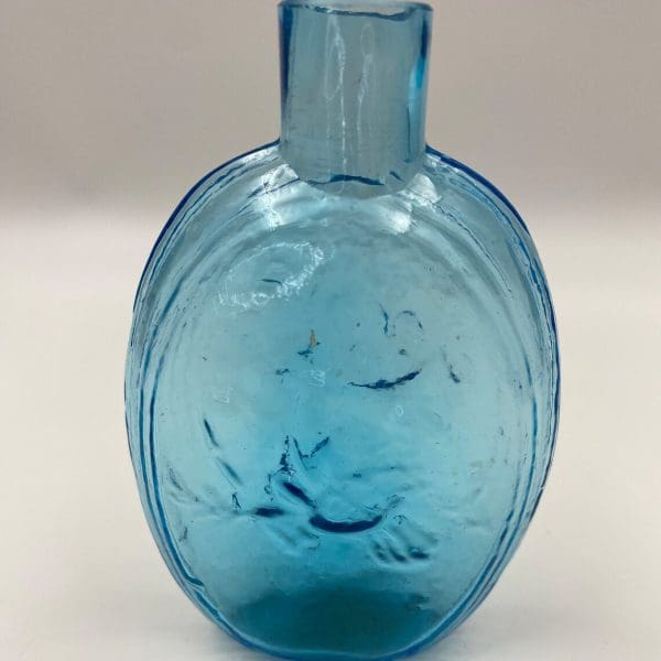 antique blue glass bottles close