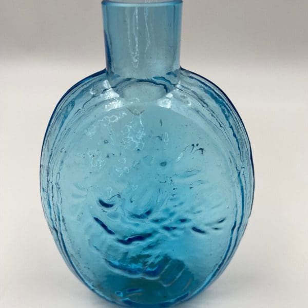 antique blue glass bottles close back