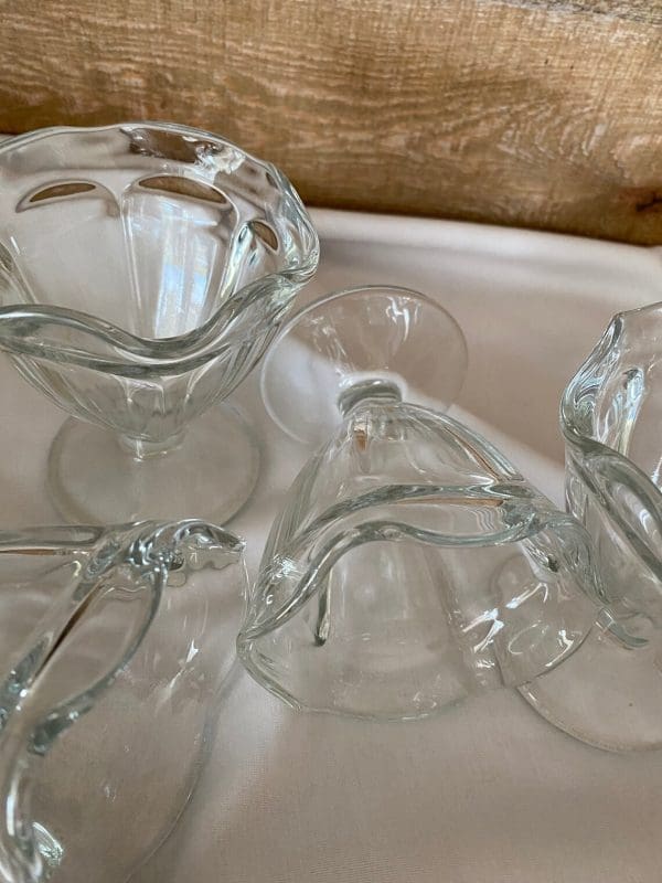 vintage glass sundae dishes close of laying on side to show dish shape