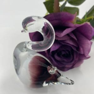 vintage handblown glass swan with flower behind close of side