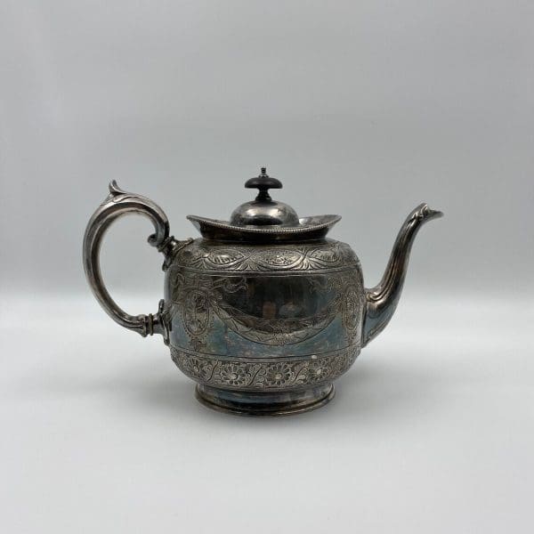 silver plate tea pot embossed from the 1880s Thomas Otley right side