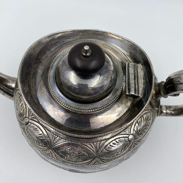 silver plate tea pot embossed from the 1880s Thomas Otley close top