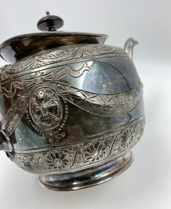 silver plate tea pot embossed from the 1880s Thomas Otley close of design all around teapot