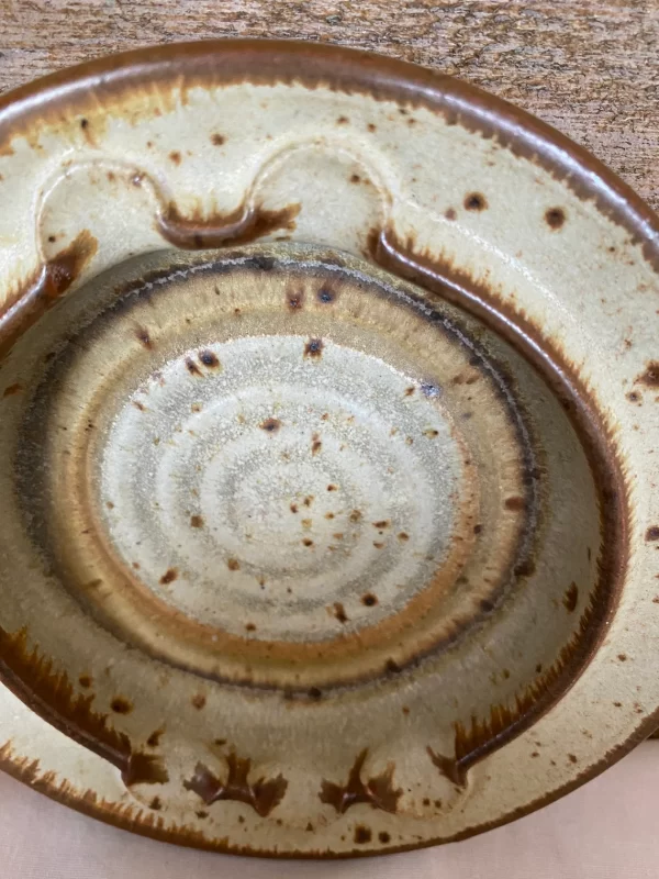 Vintage pottery ashtray signed Owens 1978 brown and beige close up