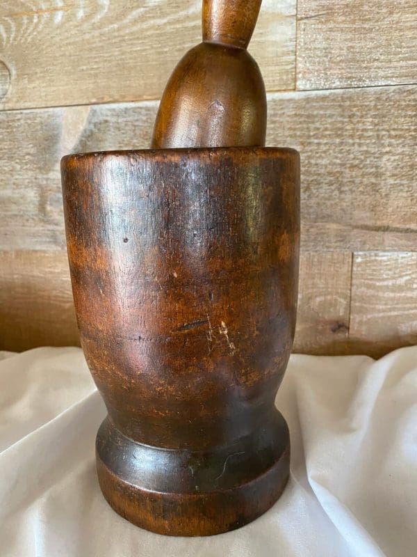 vintage wood mortar and pestle close wear marks