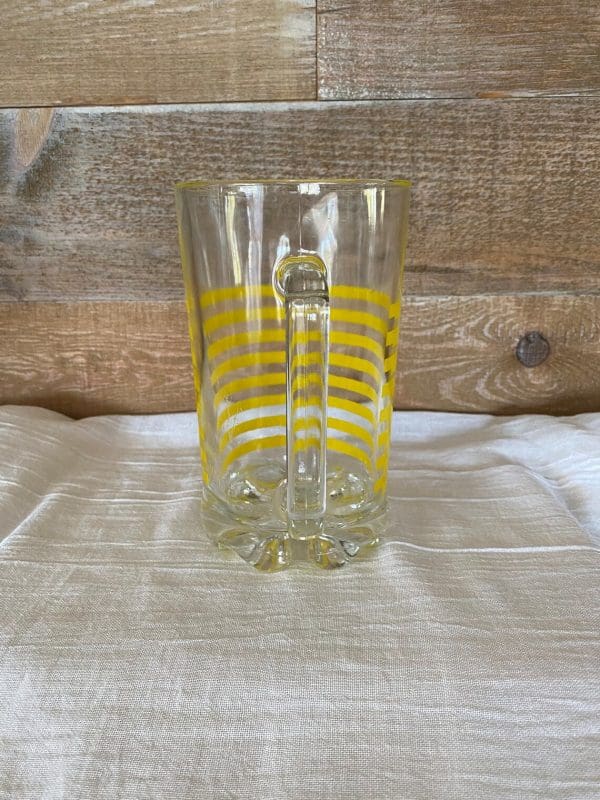 Italian glass pitcher clear glass yellow stripe handle