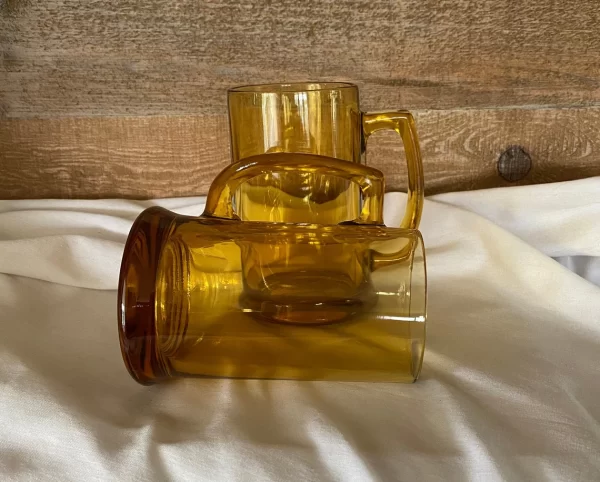 glass beer mugs one laying on side