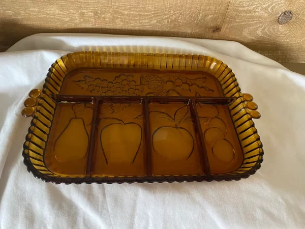 amber glass tray divided with fruit in each section