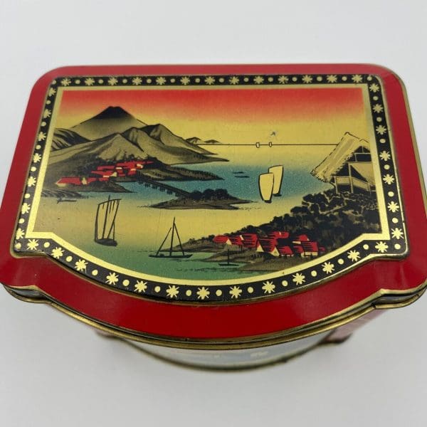 Japanese tea tin close top showing water scene