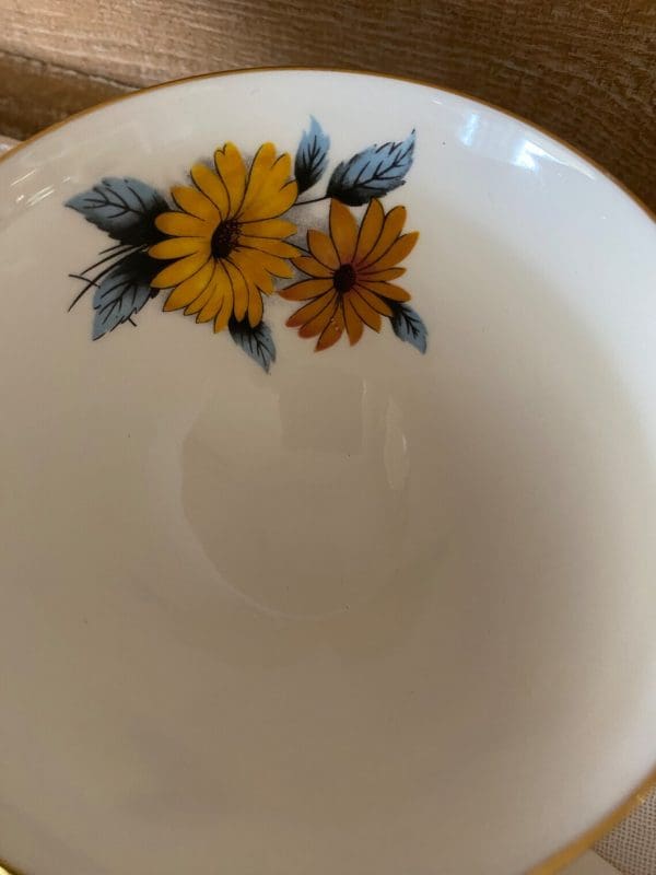 flowered tea cups Black Eye Susan inside flower on tea cup