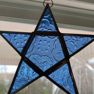 vintage suncatchers in window blue glass star