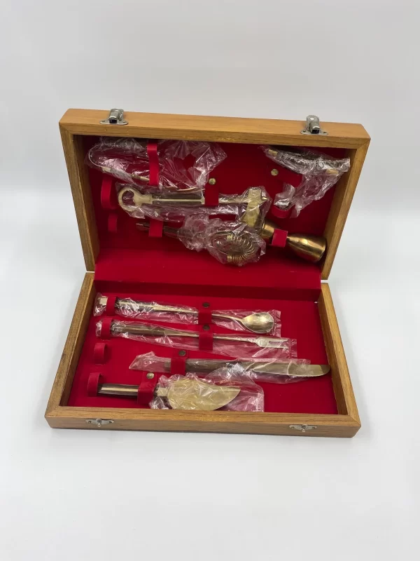 brass bar tools in wooden box